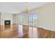 Spacious living room with hardwood floors and a cozy fireplace at 1 Vendue Range # I, Charleston, SC 29401