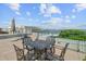 Roof deck with stylish outdoor seating, perfect for enjoying the scenic waterfront views at 1 Vendue Range # I, Charleston, SC 29401