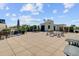Large roof deck with ample seating areas and lush plants, ideal for entertaining guests at 1 Vendue Range # I, Charleston, SC 29401