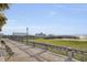 Picturesque waterfront view featuring a pier extending into the water and lush green vegetation at 1 Vendue Range # I, Charleston, SC 29401