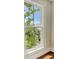 Close-up of a beautiful window with tree-lined views of the surrounding neighborhood at 1 Vendue Range # I, Charleston, SC 29401
