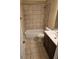 Clean bathroom featuring tiled walls, a shower-tub combo, and updated fixtures at 103 Bruce Ct, Summerville, SC 29486