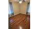 Bright bedroom with hardwood floors, a ceiling fan, and decorative curtains at 103 Bruce Ct, Summerville, SC 29486