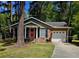 Charming brick home with an attached garage and a well-maintained lawn at 103 Bruce Ct, Summerville, SC 29486