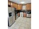 Well-lit kitchen featuring stainless steel appliances, wood cabinets, and tiled backsplash at 103 Bruce Ct, Summerville, SC 29486