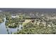 Wide aerial shot of property near lake with lush green landscape and water access at 107 Jacks Ln, Bonneau, SC 29431