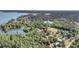 High angle aerial view showcasing the property near the lake and lush surroundings at 107 Jacks Ln, Bonneau, SC 29431