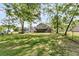 Large, fenced backyard with mature trees and plenty of space for recreation at 107 Jacks Ln, Bonneau, SC 29431