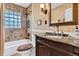 Traditional bathroom with a marble countertop, vintage faucet, tiled shower and glass block window at 107 Jacks Ln, Bonneau, SC 29431