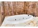 Luxurious bathtub surrounded by decorative tile, perfect for relaxation and comfort at 107 Jacks Ln, Bonneau, SC 29431