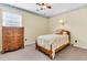 Cozy bedroom with a single bed, wooden dresser, and a window with natural light at 107 Jacks Ln, Bonneau, SC 29431