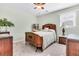 Comfortable bedroom with antique furniture, a bed with a white comforter, and a ceiling fan at 107 Jacks Ln, Bonneau, SC 29431