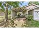 Covered carport attached to the home, offering sheltered parking, with foliage around the perimeter at 107 Jacks Ln, Bonneau, SC 29431