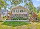 Inviting home with a spacious porch, manicured lawn, and tiered deck access to the upper level at 107 Jacks Ln, Bonneau, SC 29431