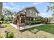 Exterior view of waterfront home showcasing multi-level decks and lush landscaping at 107 Jacks Ln, Bonneau, SC 29431