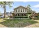 Spacious waterfront home with decks, beautiful landscaping, and waterfront views at 107 Jacks Ln, Bonneau, SC 29431
