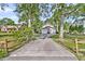 Traditional two-story home with a wide driveway and a three-car garage at 107 Jacks Ln, Bonneau, SC 29431