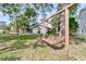 A swing hangs from a tree in the front yard of this traditional two-story home with a three-car garage at 107 Jacks Ln, Bonneau, SC 29431