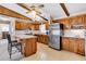 Traditional kitchen featuring wood cabinets, stainless steel appliances, and granite countertops at 107 Jacks Ln, Bonneau, SC 29431