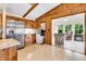 View of a kitchen equipped with stainless steel appliances, wood cabinetry, and a tile floor pattern at 107 Jacks Ln, Bonneau, SC 29431