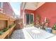 Inviting back patio with custom tiling, beautiful plants, and a sliding glass door at 1126 Rearick Rd, Johns Island, SC 29455