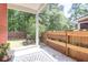 Cozy back patio with a grill and a custom planter on the fence in the backyard at 1126 Rearick Rd, Johns Island, SC 29455