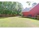 Large fenced backyard with a well-maintained lawn and mature trees at 1126 Rearick Rd, Johns Island, SC 29455