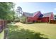 Expansive backyard with well-manicured lawn, fire pit, and lush green surroundings at 1126 Rearick Rd, Johns Island, SC 29455
