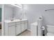 Bright bathroom featuring a double sink vanity with white cabinets and modern fixtures at 1126 Rearick Rd, Johns Island, SC 29455