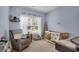 Bedroom with glider, crib, and surfboard at 1126 Rearick Rd, Johns Island, SC 29455