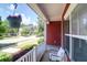 View from the front porch with hanging flower and chair at 1126 Rearick Rd, Johns Island, SC 29455