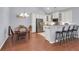 Bright kitchen and dining area with white cabinets, stainless steel appliances, and seating at the counter at 1126 Rearick Rd, Johns Island, SC 29455