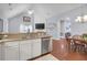 Open kitchen with granite countertops, stainless steel appliances, and an adjacent dining area and living room at 1126 Rearick Rd, Johns Island, SC 29455