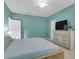 Bright bedroom with a wooden bed frame, dresser with TV, and a ceiling fan at 1126 Rearick Rd, Johns Island, SC 29455