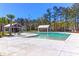 Community pool with white buildings, palm trees, and clear blue skies, perfect for relaxing and enjoying the outdoors at 1126 Rearick Rd, Johns Island, SC 29455