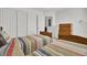 Cozy bedroom featuring twin beds, closet, and dresser, complemented by white walls and carpet, offering comfort and functionality at 117 Red Leaf Blvd, Moncks Corner, SC 29461