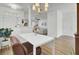 Bright dining room with a modern table and chairs and a view to living room and kitchen at 117 Red Leaf Blvd, Moncks Corner, SC 29461