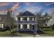 Charming two-story home boasts a double porch, nice landscaping and a beautiful, colorful sunset backdrop at 117 Red Leaf Blvd, Moncks Corner, SC 29461