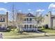 Traditional two-story home with double porches, a landscaped front yard, and a charming street view at 117 Red Leaf Blvd, Moncks Corner, SC 29461