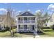 Two-story traditional home with double porches, nicely landscaped front yard and beautiful curb appeal at 117 Red Leaf Blvd, Moncks Corner, SC 29461