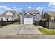 A detached one car garage at the rear of the property with a long concrete driveway and fenced in yard at 117 Red Leaf Blvd, Moncks Corner, SC 29461