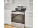 Modern kitchen featuring stainless steel range, white countertops and cabinets, and gold hardware at 117 Red Leaf Blvd, Moncks Corner, SC 29461
