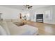 Bright open-concept living room with white walls, shuttered windows, and a comfortable white sectional sofa at 117 Red Leaf Blvd, Moncks Corner, SC 29461
