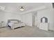 Spacious main bedroom features plush carpet, a tray ceiling, and modern furnishings at 117 Red Leaf Blvd, Moncks Corner, SC 29461
