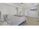 Light and airy main bedroom features a tray ceiling and ensuite bathroom access at 117 Red Leaf Blvd, Moncks Corner, SC 29461