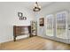 Bright mud room featuring wood floors, a wood bench, and a doorway to the backyard at 117 Red Leaf Blvd, Moncks Corner, SC 29461
