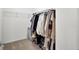 Functional walk-in closet with ample hanging space and shelving provides efficient storage in a minimalist design at 117 Red Leaf Blvd, Moncks Corner, SC 29461