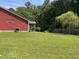 Large backyard with well-maintained lawn, screened porch, and privacy fence at 1297 Segar St, Johns Island, SC 29455