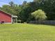 Expansive backyard featuring lush green grass, a privacy fence, and mature trees at 1297 Segar St, Johns Island, SC 29455