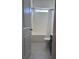 Bright bathroom featuring a shower-tub combo and tiled floors at 1297 Segar St, Johns Island, SC 29455